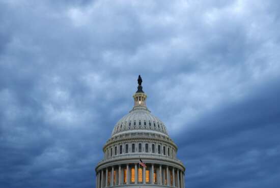 FILE - In this June 12, 2019, file photo, clouds roll over the U.S. Capitol dome as dusk approaches in Washington. The committee charged with helping Republicans wrest control of the House next year raised $45.4 million over the last three months, a record quarterly haul during a year without a national election. (AP Photo/Patrick Semansky, File)