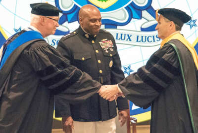 DIA Director Lt. Gen. Vincent Stewart, USMC, (center) presided at the formal change of Presidency as Dr. David R. Ellison (left) transferred the authority, responsibility, and accountability for NIU to Dr. J. Scott Cameron (right) on Friday, 25 August 2017.