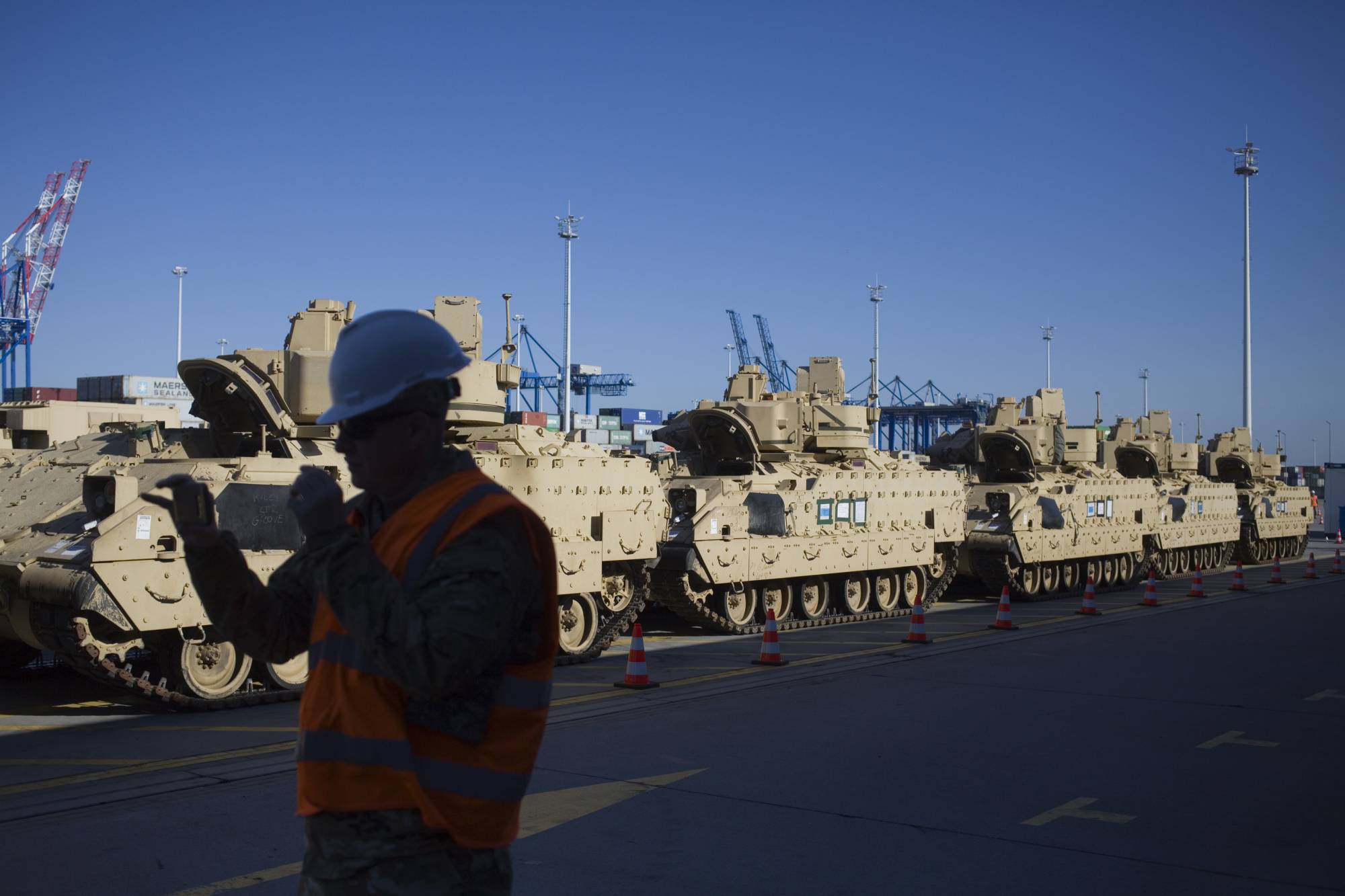 U.S. Army military vehicles stand after unloading in the port in Gdansk, Poland, Wednesday, Sept. 13, 2017. The equipment supply is a second heel-to-toe deployment of U.S. troops to the nation that is concerned for its security due to neighboring Russia's military activity. (AP Photo/Krzysztof Mystkowski)