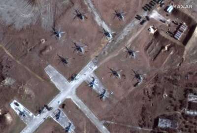 This Sunday, Feb. 13, 2022, satellite image provided by Maxar Technologies shows the close up of helicopters and troops near Lake Donuzlav, Crimea. (Satellite image ©2022 Maxar Technologies via AP)