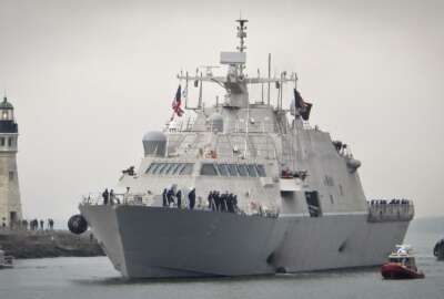 The new USS Little Rock arrives at Buffalo harbor with a police and fireboat escort, Monday, Dec. 4, 2017, in Buffalo, N.Y. The littoral combat ship will be docked on the Lake Erie waterfront until its commissioning Dec. 16, 2017. (AP Photo/Carolyn Thhompson)